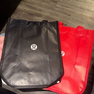 lululemon athletica Black and Red Tote/lunch Bag. You get both. See all pics.